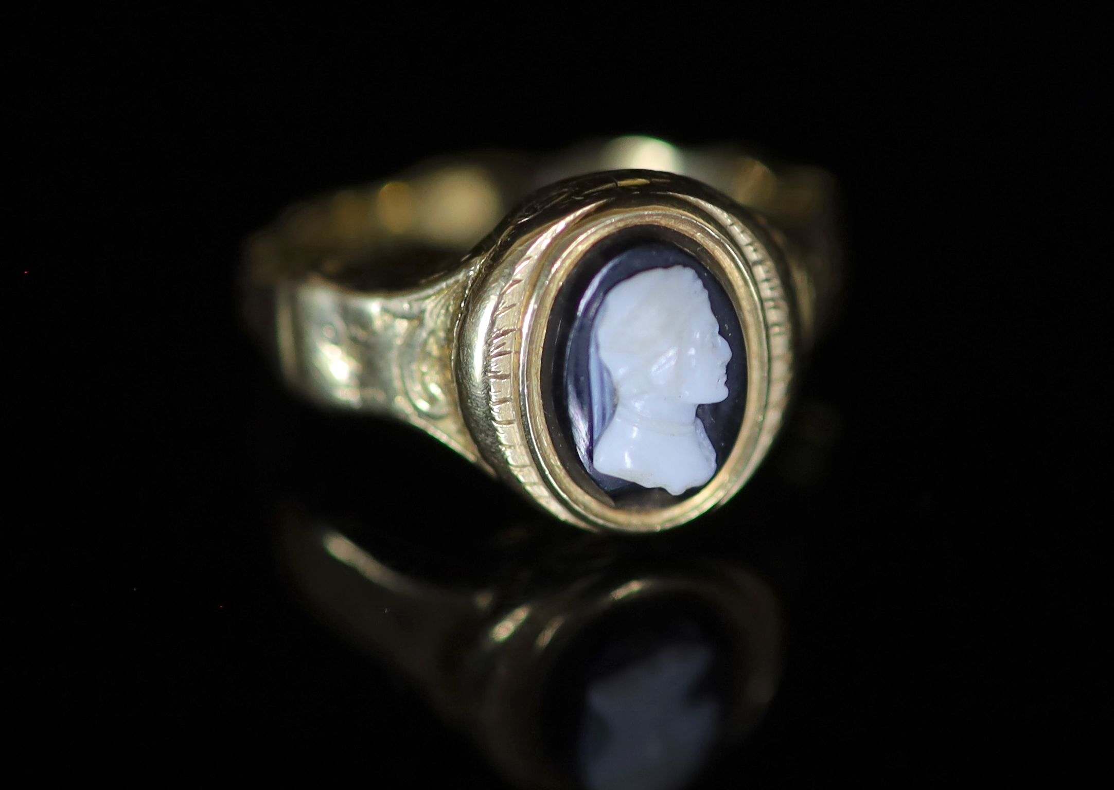 An early 19th century gold and cameo set poison ring